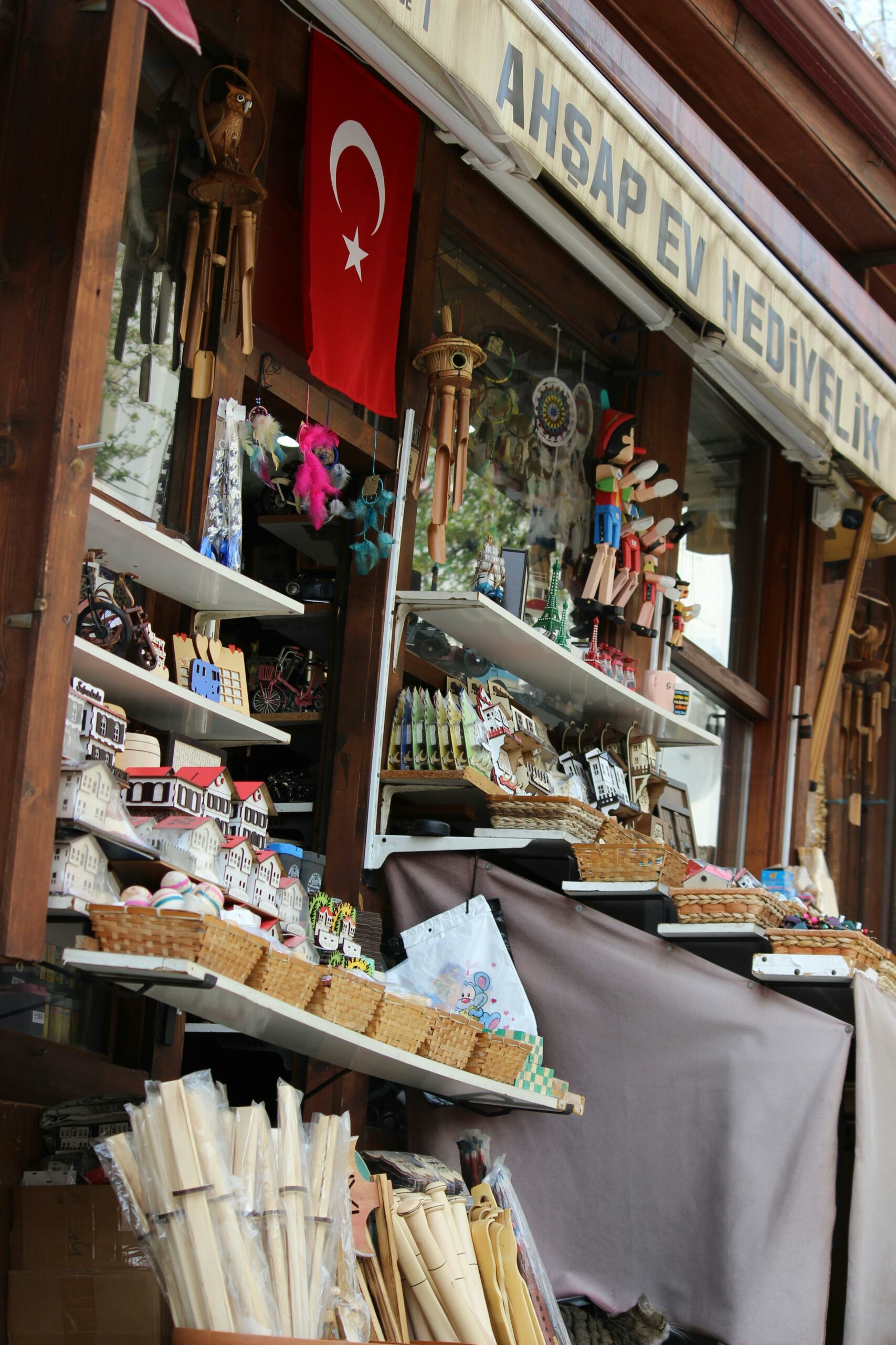 Colorful market stall in Safranbolu, Türkiye showcasing handmade crafts and wood products.